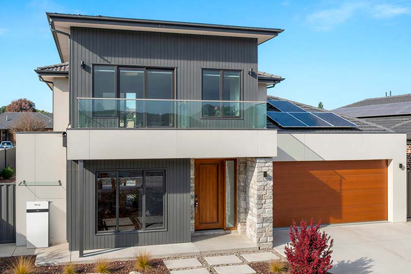 Home with solar battery system installed outside