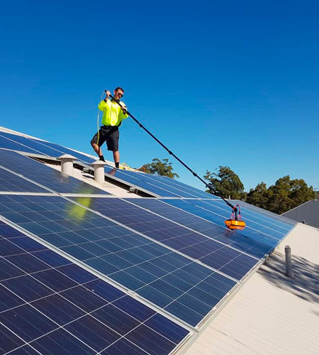 Green Sun Solutions installer cleaning solar panels